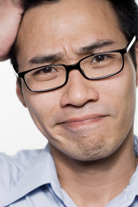 Man Scratching Head
